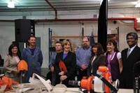Minister Yelich and Minister Ambrose along with Provincial Forestry Warehouse staff examine the equipment that will be used by workers employed through the FireSmart program.