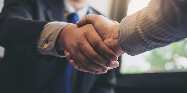 Two business men shaking hands